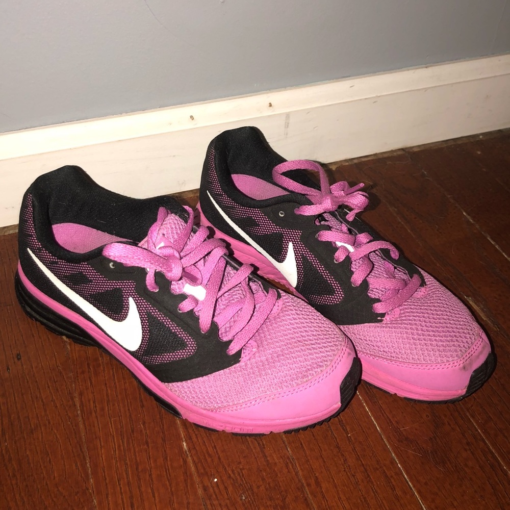 Pink and black nike zoom fly sneakers
